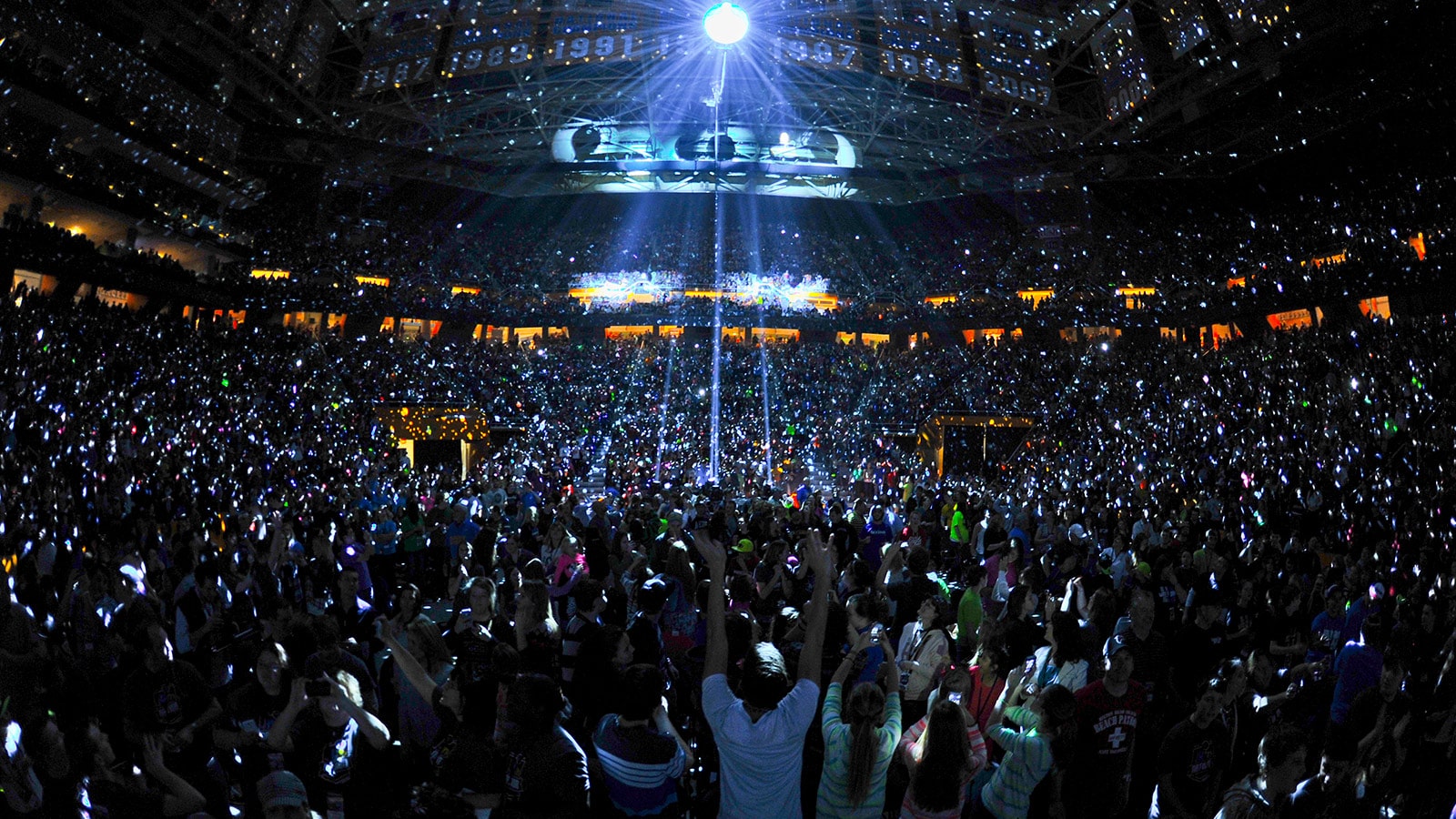 A Winter Jam concert crowd beneath arena lights